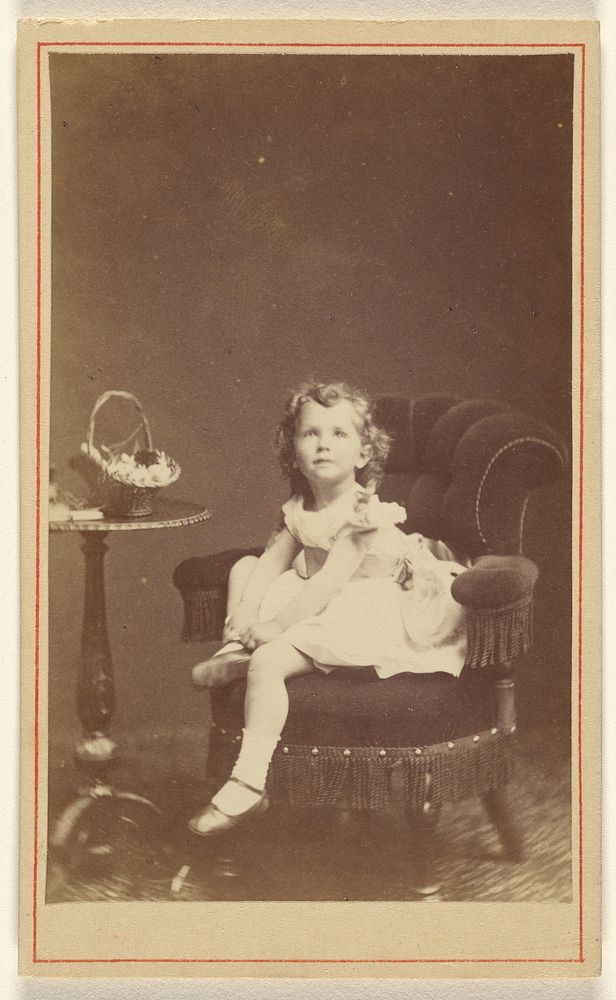 Little girl posed and seated by London Stereoscopic and Photographic Company