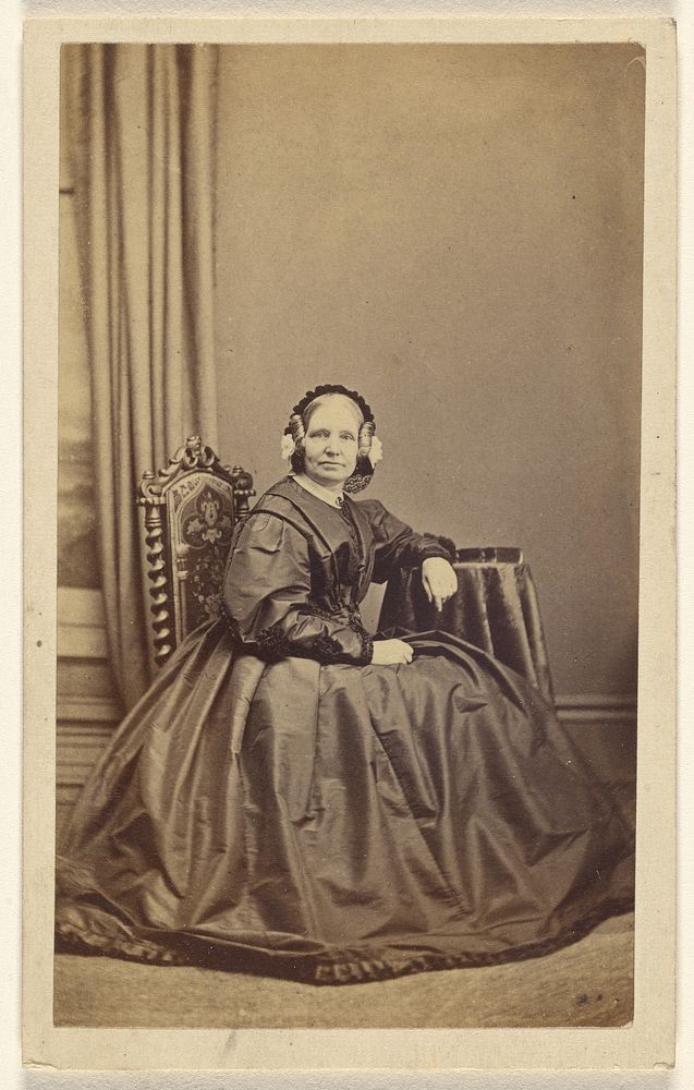 Unidentified middle-aged woman, seated by Lloyd and Jefferson