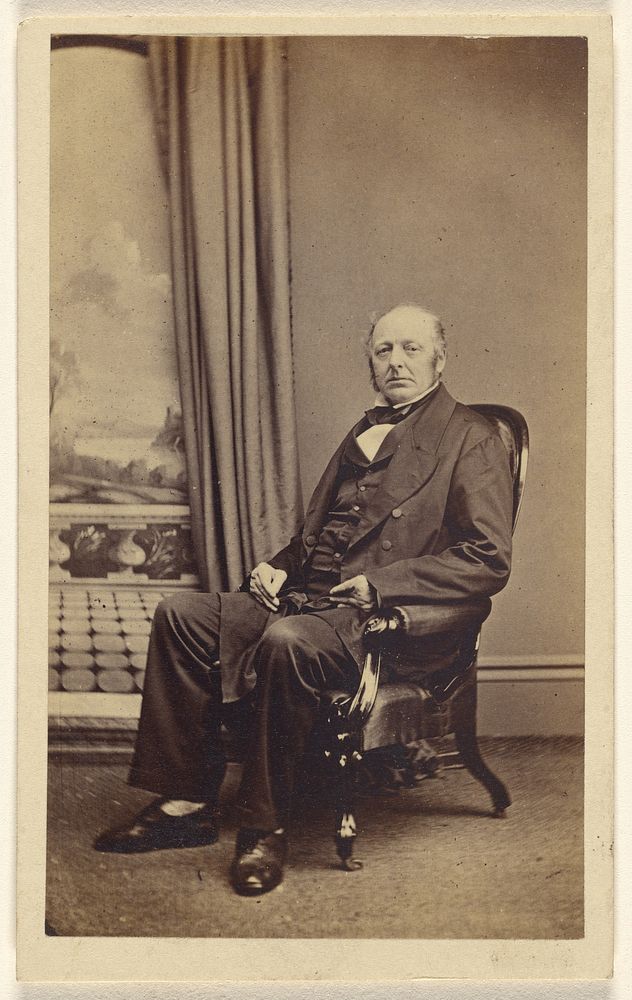 Unidentified middle-aged man, seated by Lloyd and Jefferson