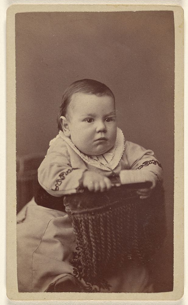 Baby posed in chair by Alexander Hesler