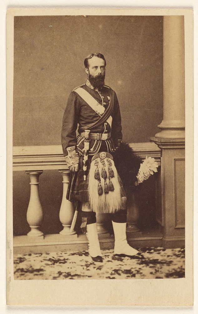 Unidentified bearded man in kilt, standing by F W Baker