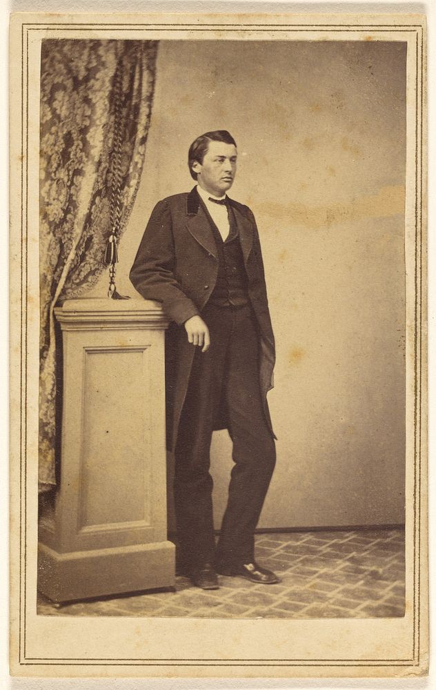 Unidentified man, standing by Elrod Brothers