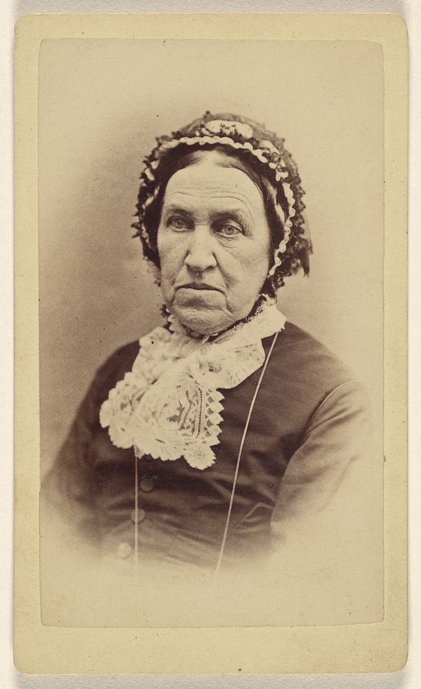 Unidentified elderly woman wearing a bonnet by L K Showman