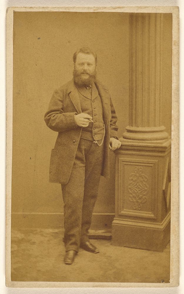 Unidentified man with full beard, standing by A Garcin