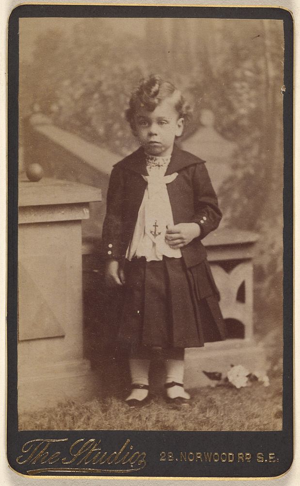 Unidentified little girl, standing by The Studio