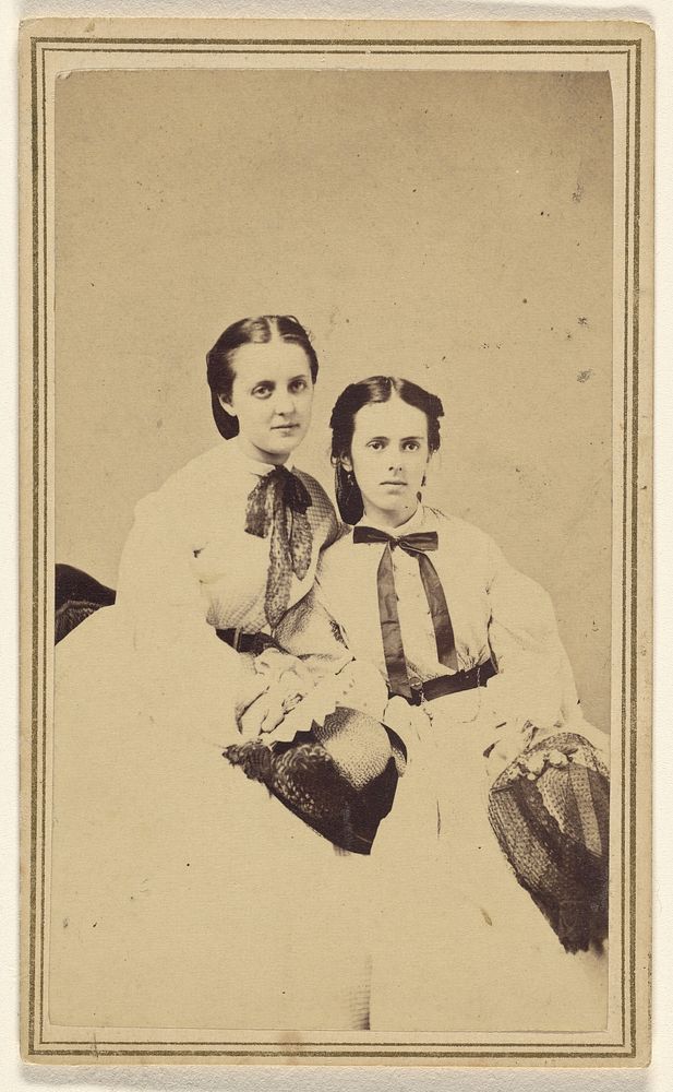 Two unidentified young women, seated by David R H Hoag and Quick