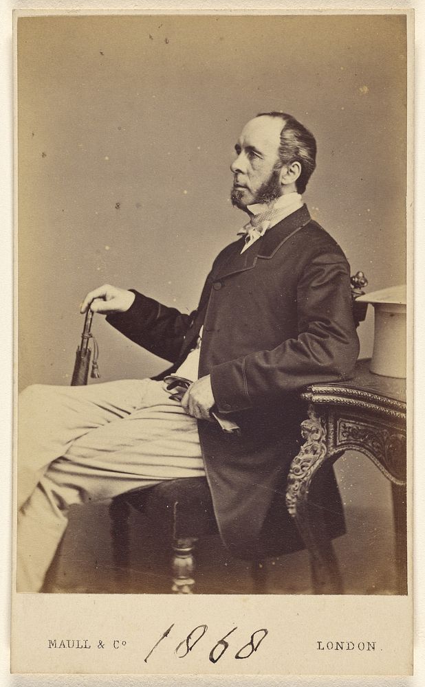 Unidentified man with goatee, moustache and muttonchops, seated, in profile by Henry Maull and Co