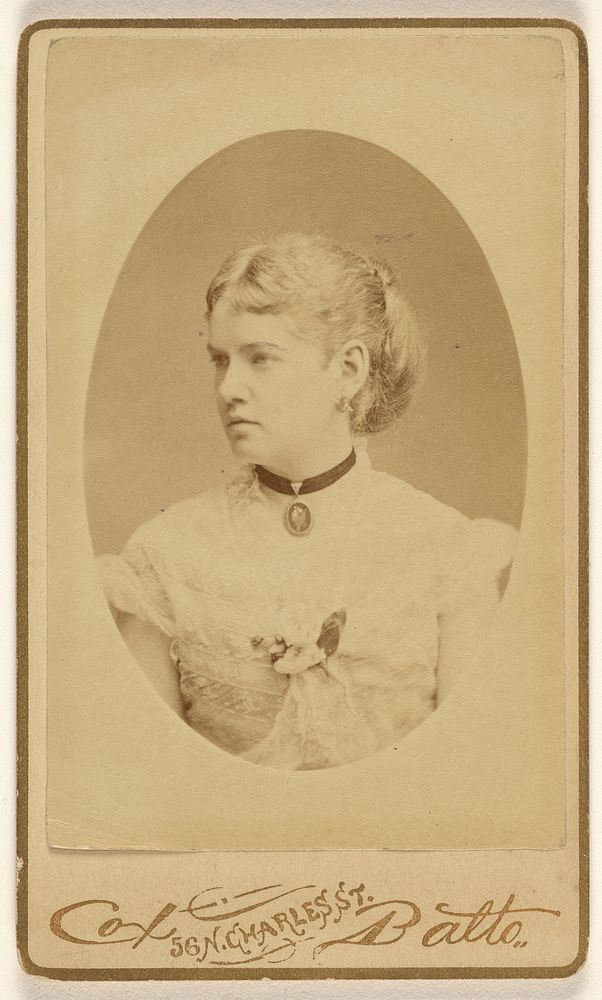Unidentified woman with cameo around her neck, in profile, printed in oval format by Cox and Batto