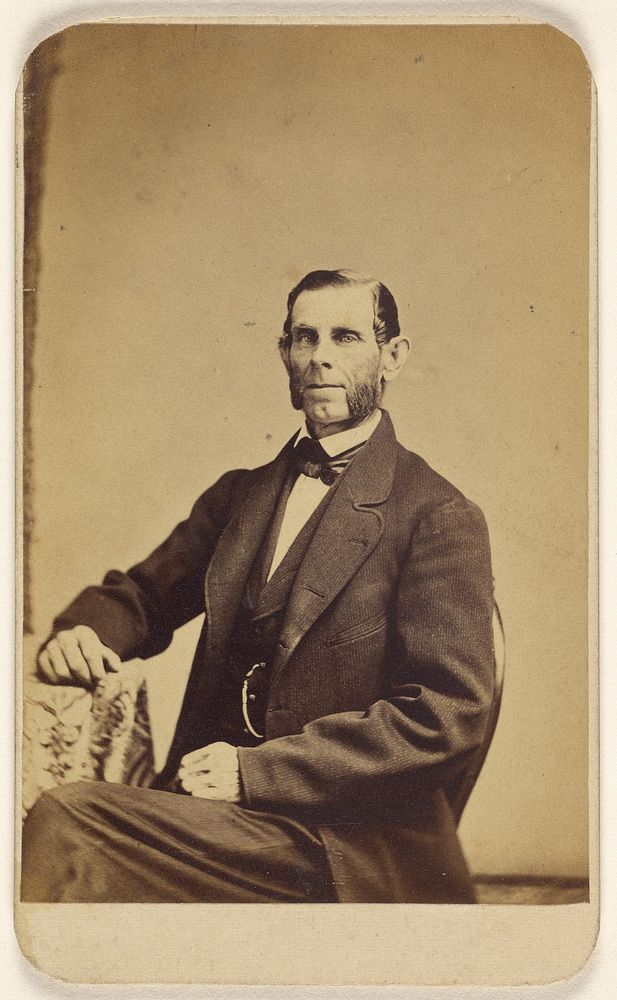 Unidentified man with full muttonchops, seated by James Cremer