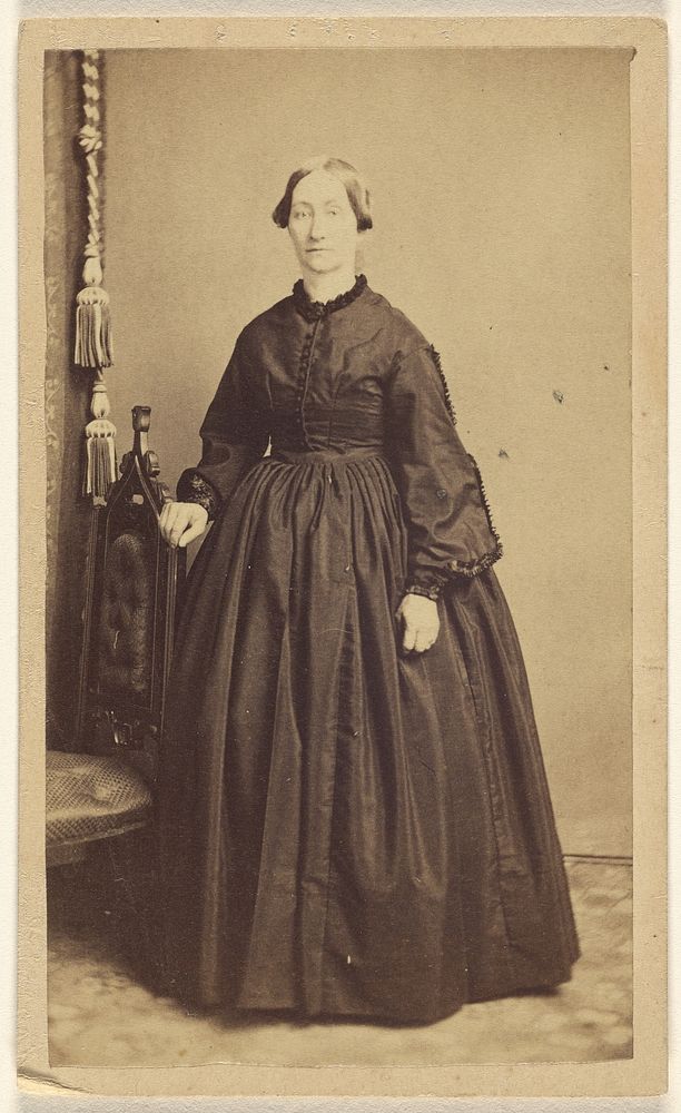 Unidentified woman, standing by R A Lord