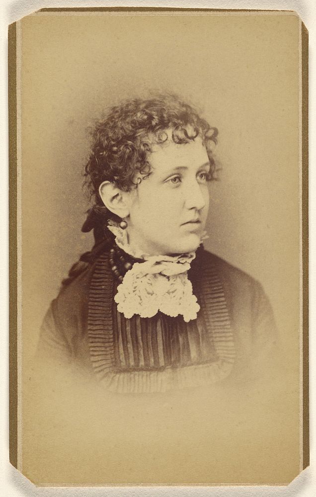 Unidentified woman with curly hair, printed in vignette-style by Henry C Lovejoy