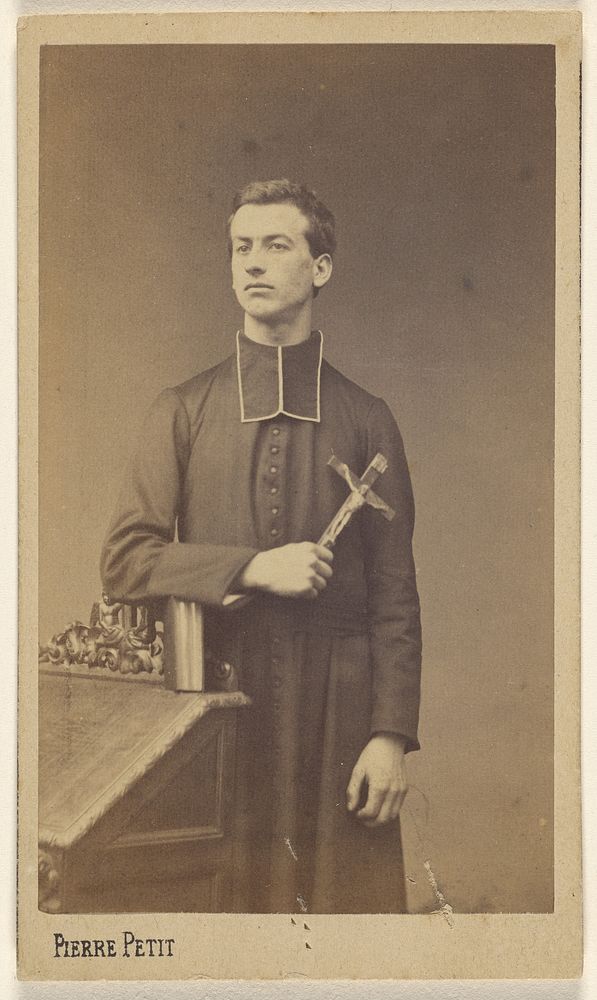 Priest holding a crucifix, standing by Pierre Petit