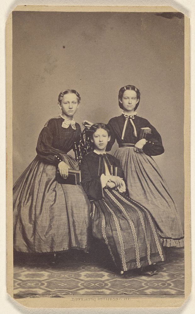 Three unidentified women: two standing, one seated at center by S G Sheaffer
