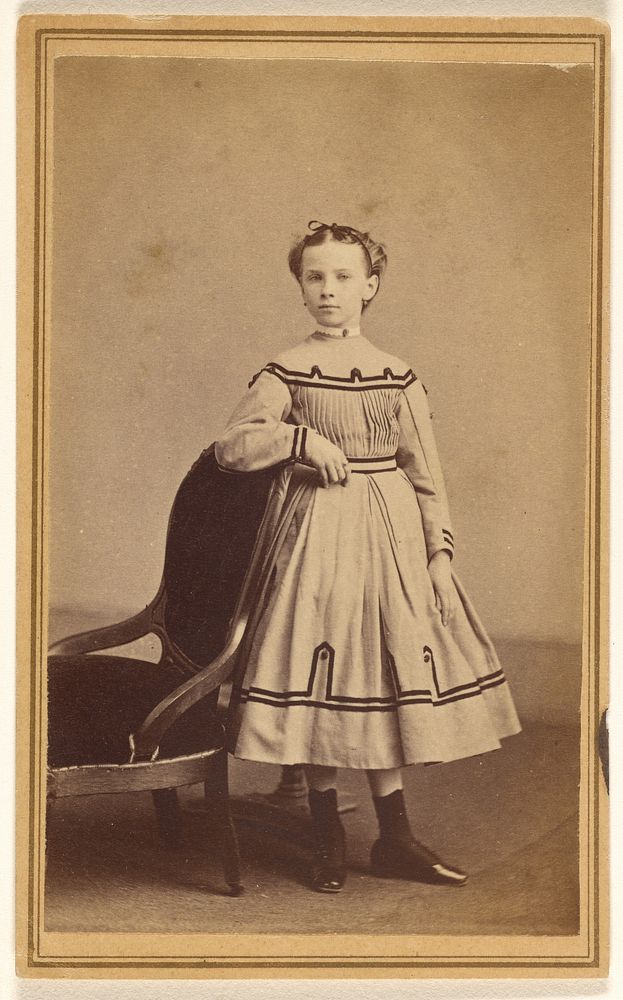 Unidentified young woman, standing by Draper and Husted