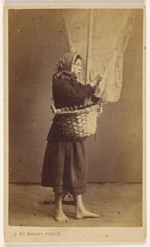Peasant woman standing, holding a basket with a long pole and net by Louis De Mauny