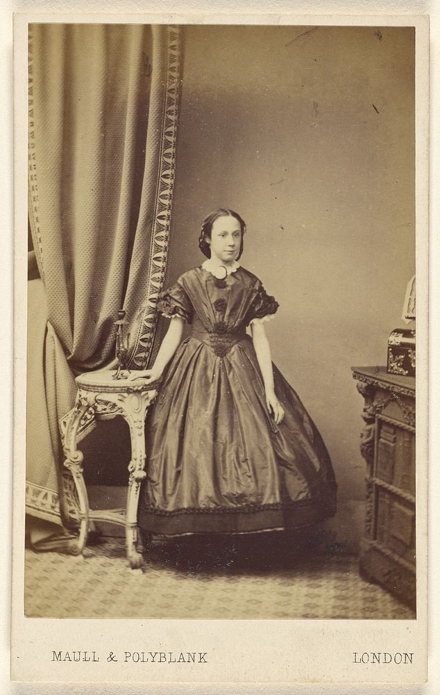Unidentified woman, standing by Maull and Polyblank
