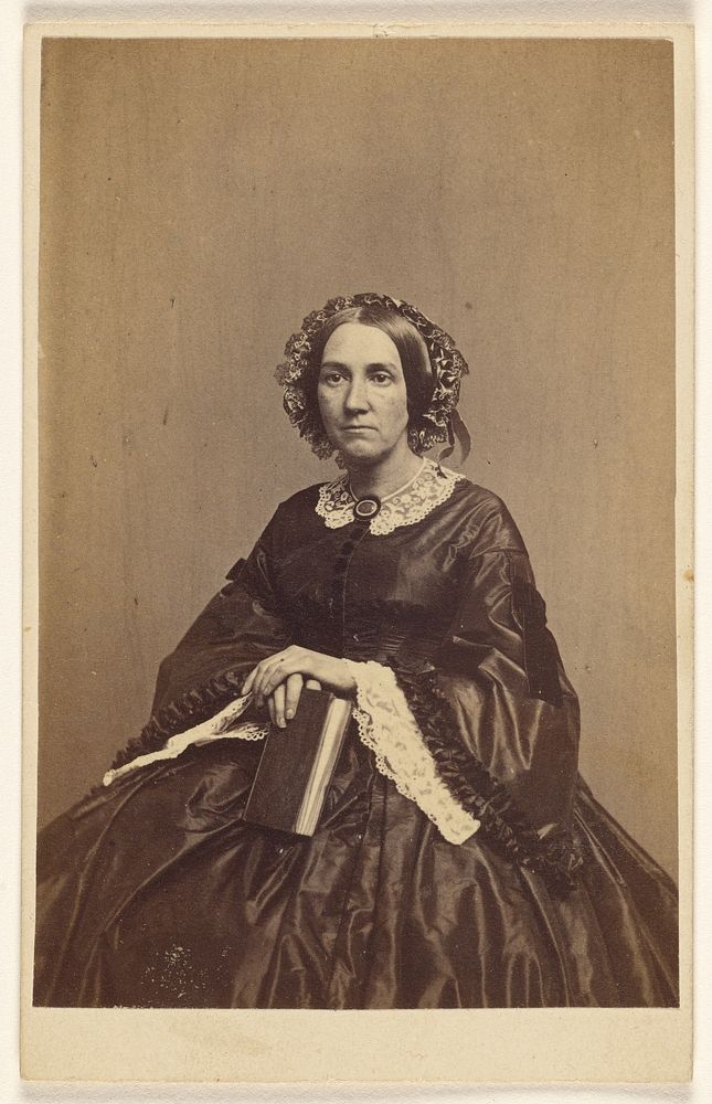 Unidentified woman holding a book, seated by K W Beniczky