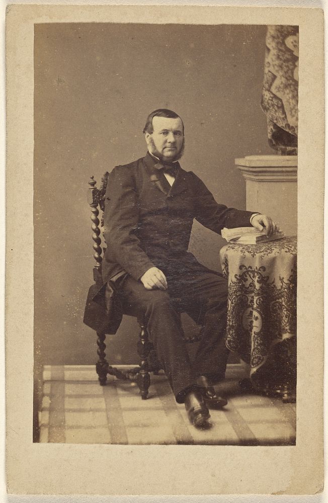 Unidentified bearded man, seated