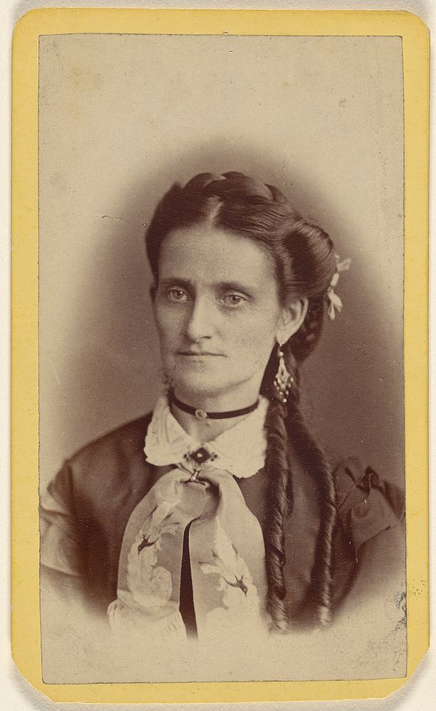 Unidentified woman with two long curls, printed in vignette-style by E J Potter