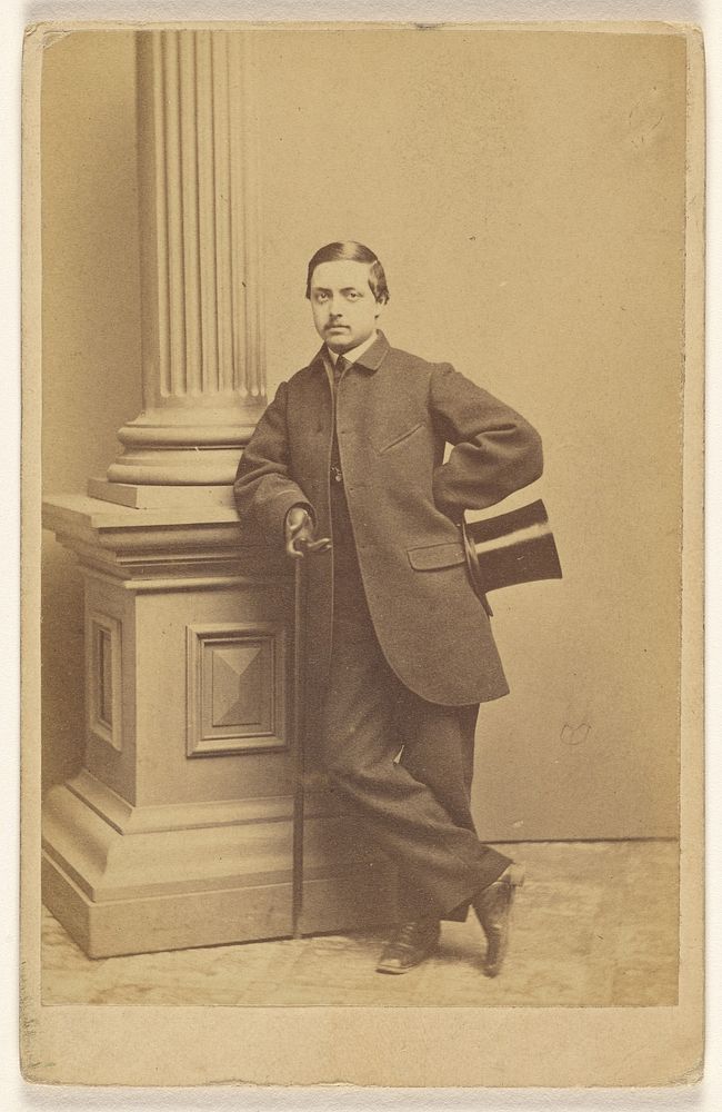 Unidentified man with moustache standing, holding a top hat in one hand, a cane in the other by Beniczky and Co