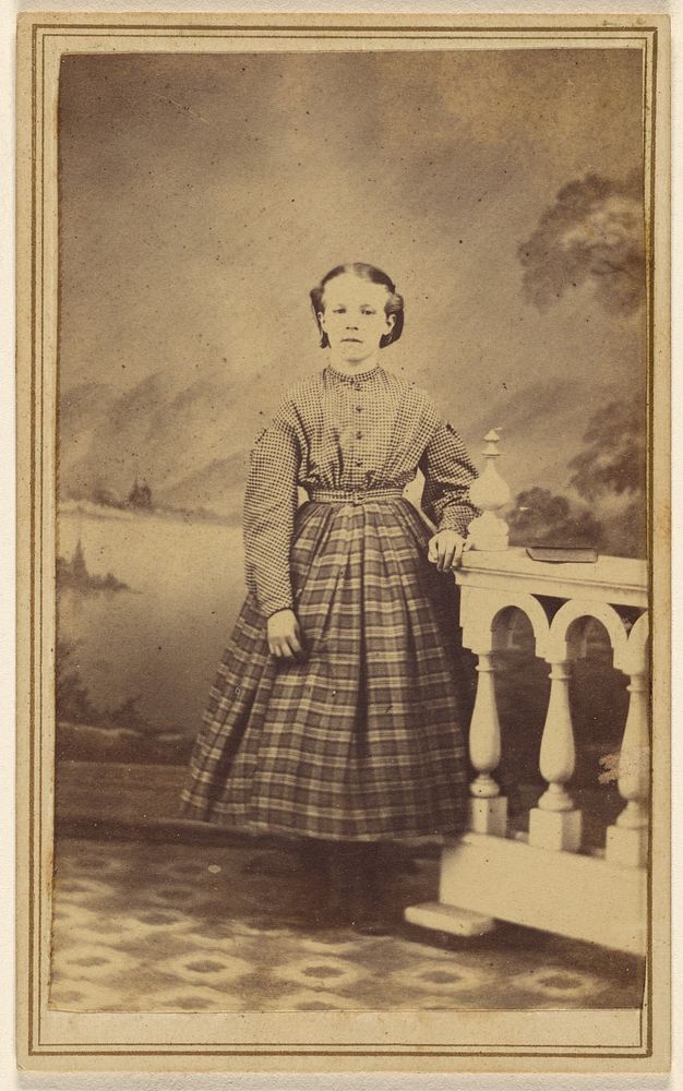Unidentified young woman in a studio setting, standing