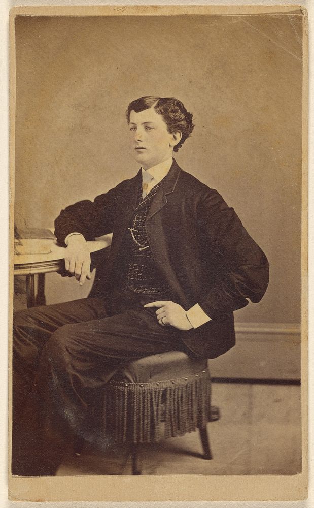 Unidentified young man seated at a table by James S Woodley
