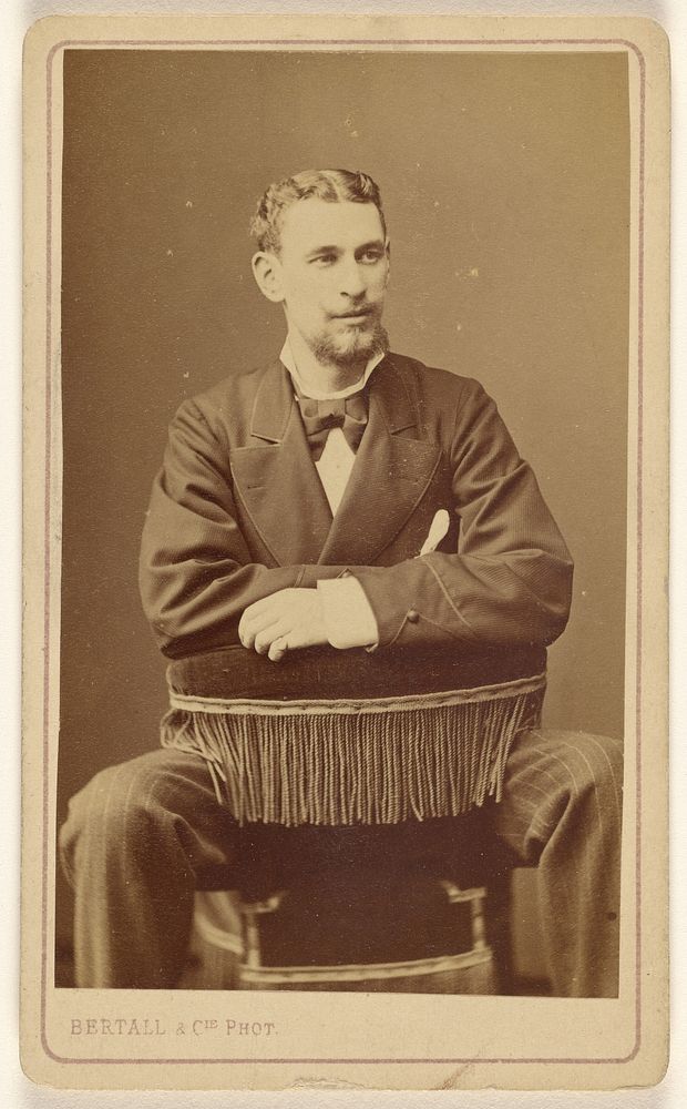 Unidentified man with Vandyke beard, seated by Bertall and Cie