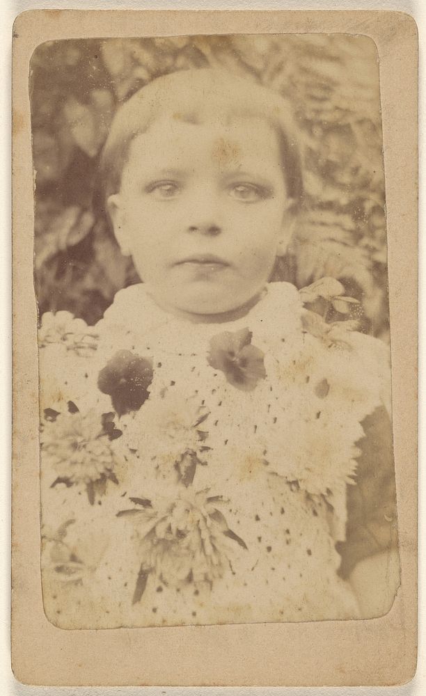 Unidentified little girl wearing a flowered dress