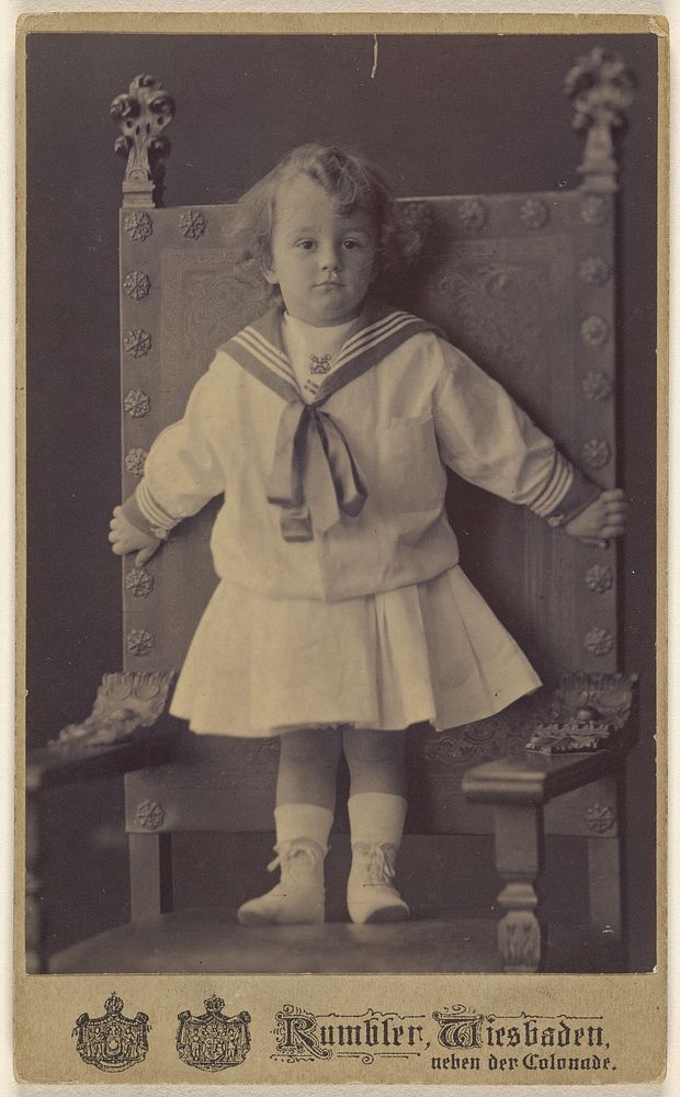 Unidentified little girl standing in an ornate chair by Rumbler