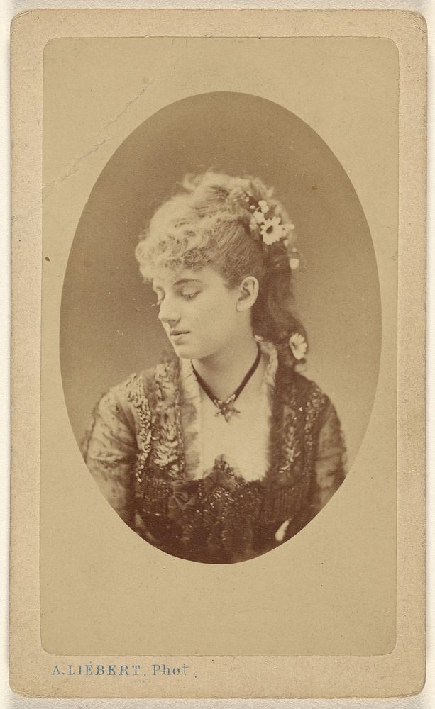 Unidentified woman looking down, printed in quasi-oval style by Alphonse J Liebert