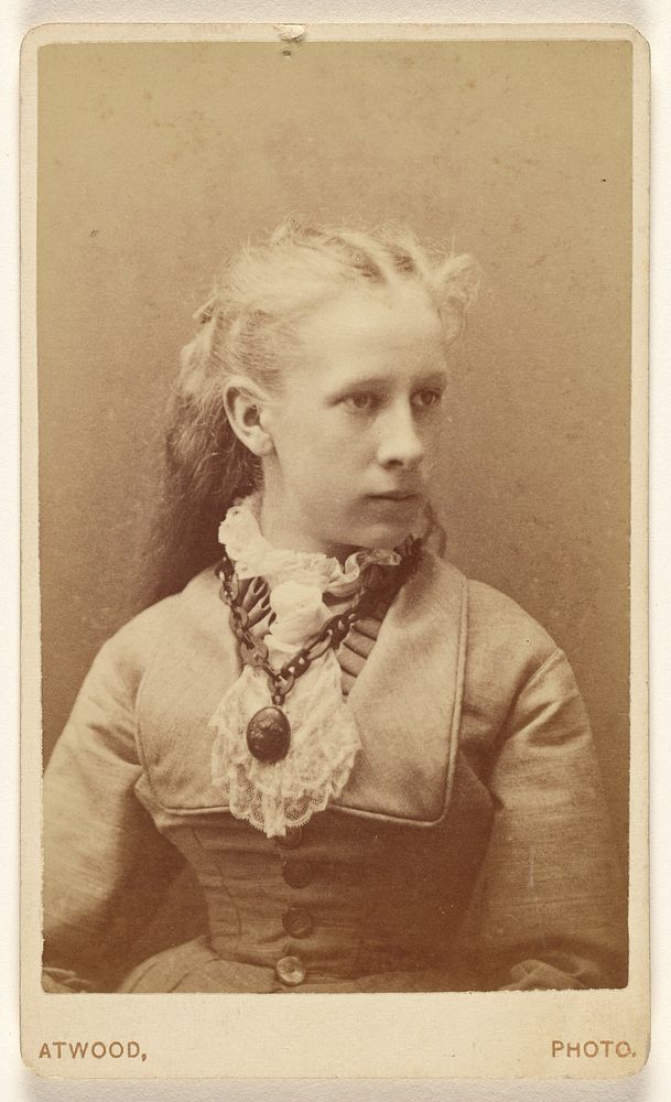 Unidentified young woman seated, in 3/4 profile by L A Atwood