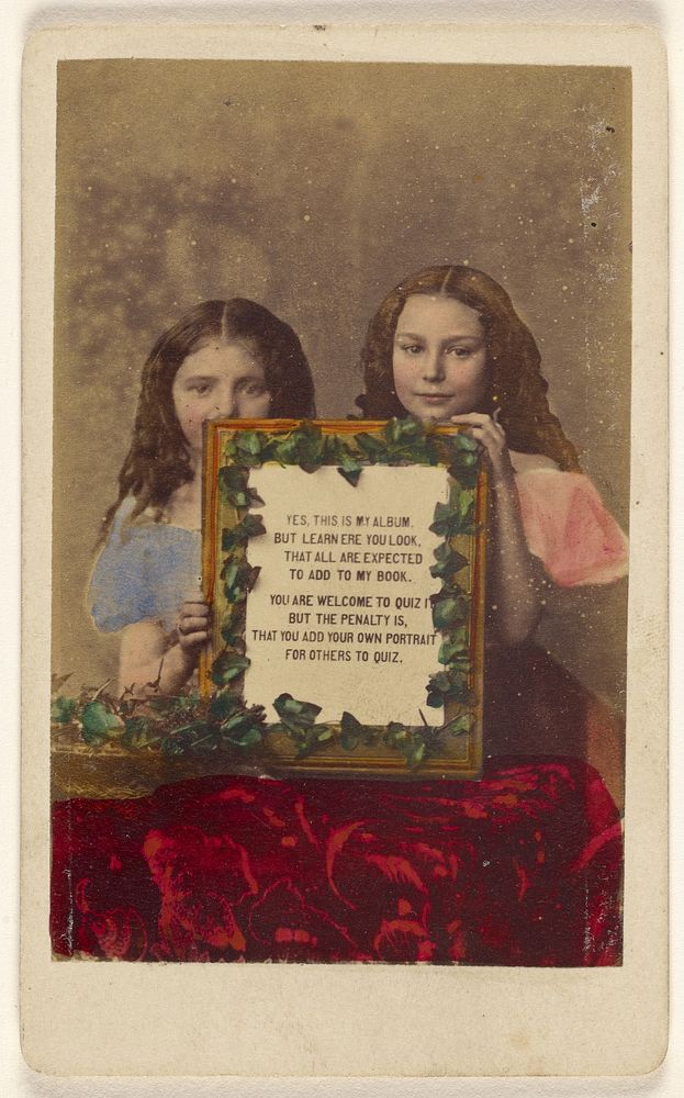 Two unidentified girls holding a framed picture with text by Burgwitz and Company