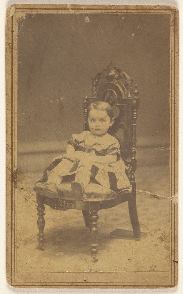 Unidentified baby girl, seated by L D Campbell