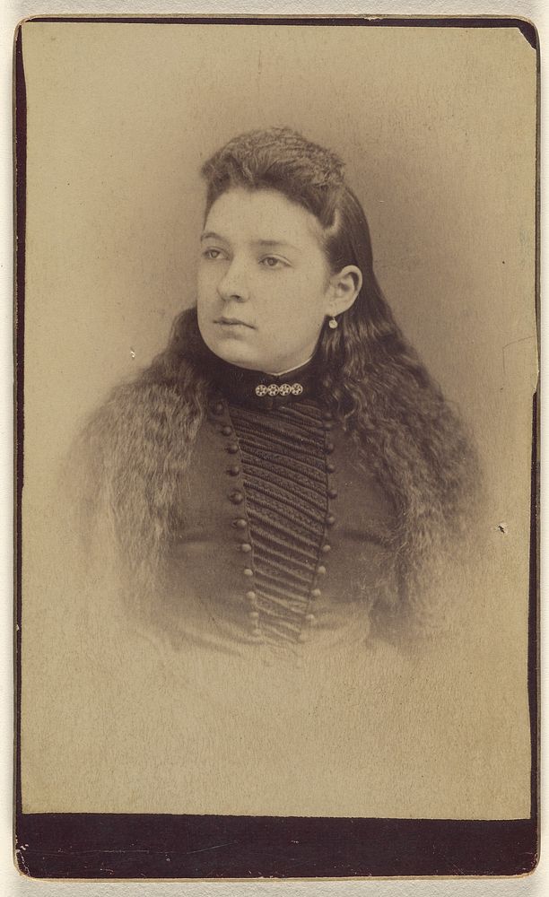 Unidentified woman with long wavy hair, printed in vignette-style by Mayhew Brothers