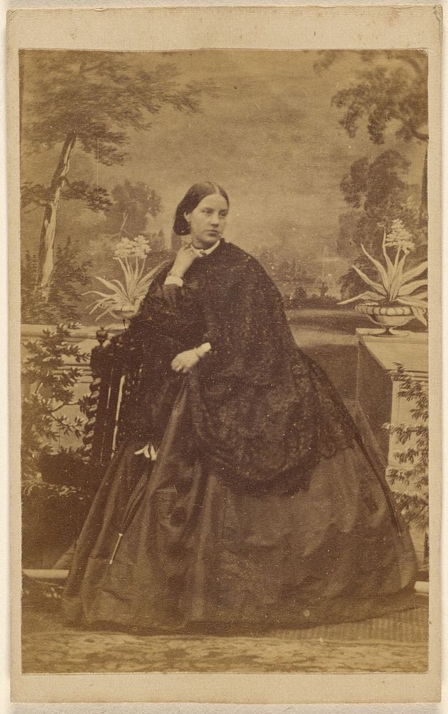 Unidentified woman seated, with hand to collar
