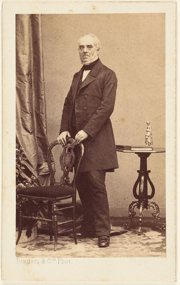 Unidentified elderly man standing, holding the back of a chair by Disdéri and Cie