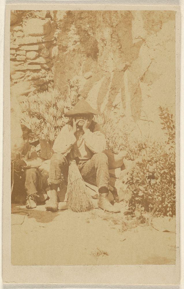 Unidentified man wearing a tricorn, seated, hands to face, a broom between his legs