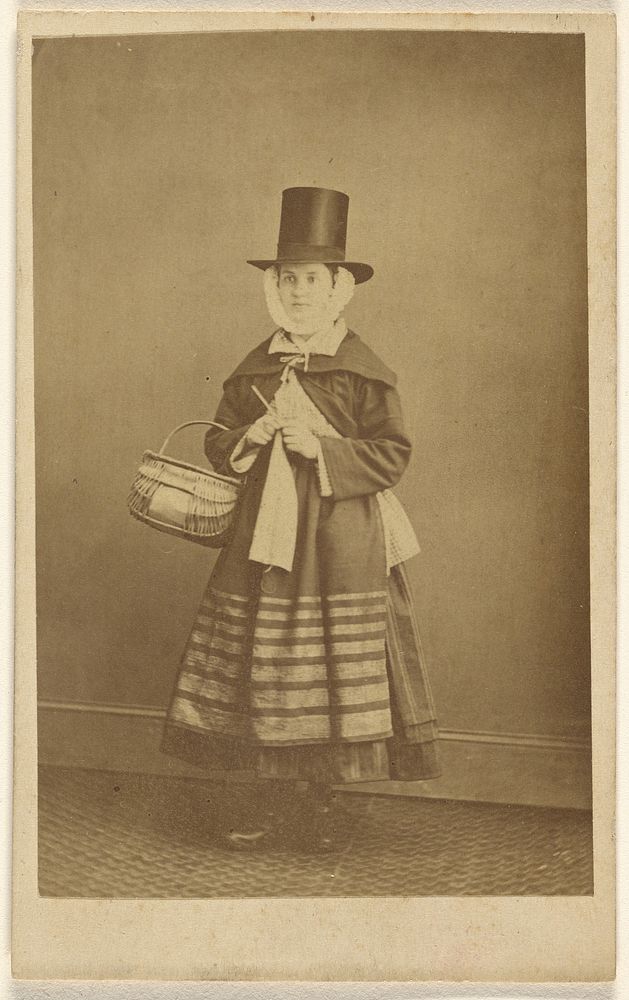 Woman dressed in traditional Welsh clothing by H J Hughes