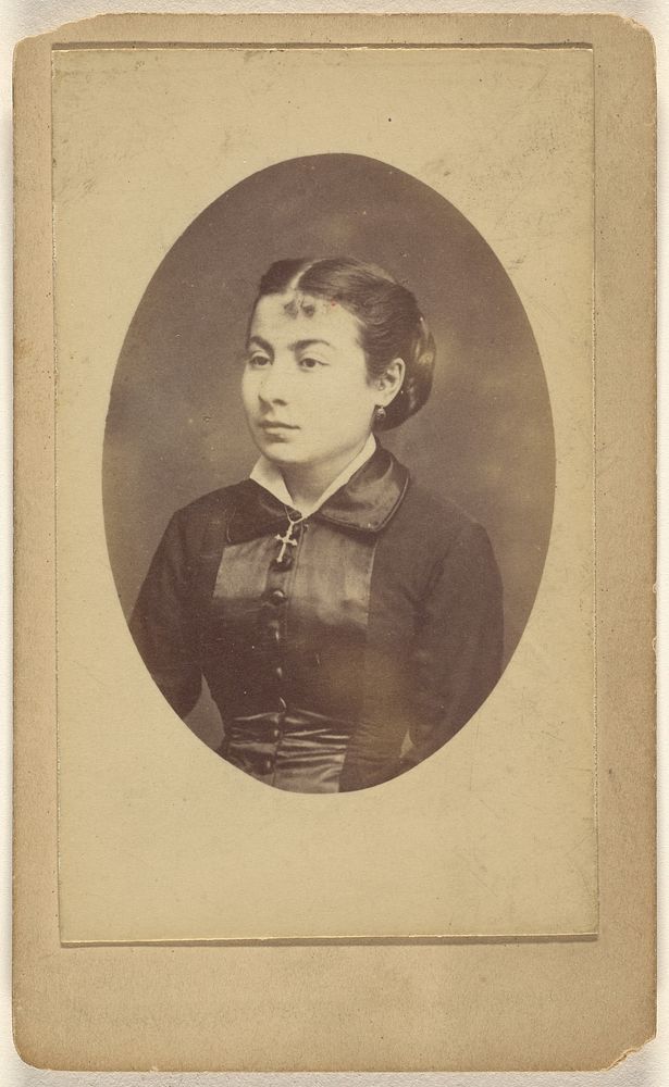 Unidentified young woman wearing a crucifix around her neck by L Muller and Rault