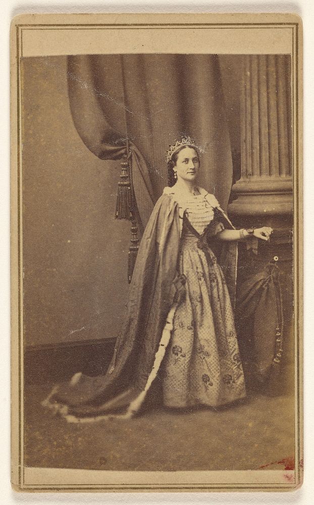 Unidentified woman wearing a tiara and cape, standing by Orrin C Benjamin