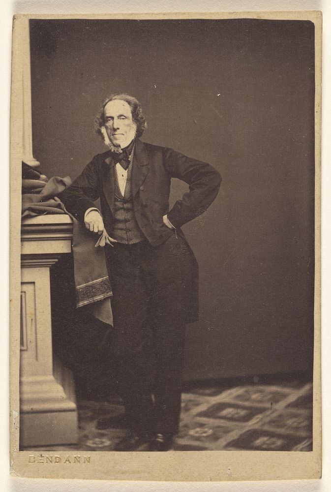 Unidentified man with white muttonchops, standing by Daniel Bendann