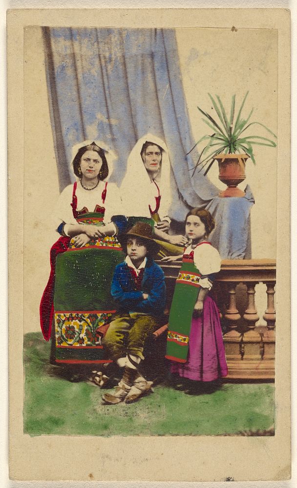 Cociare [two unidentified women seated next to a boy seated and a girl standing, all wearing native costumes] by Antonio…