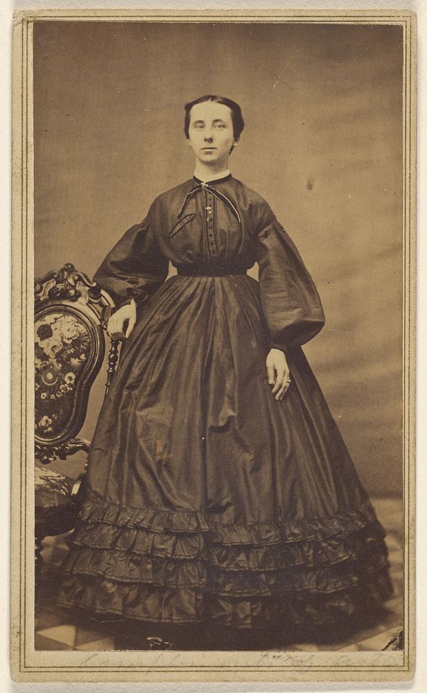 Unidentified woman, standing by T R Rutherford