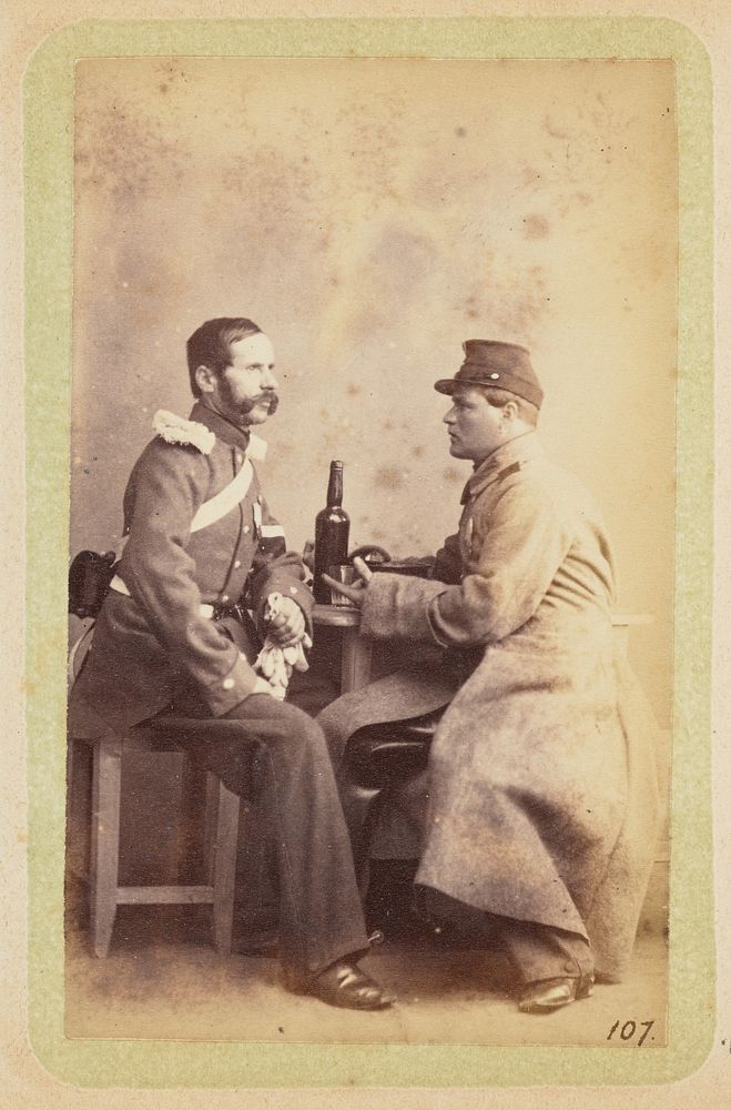 Two men seated at a table by William Carrick