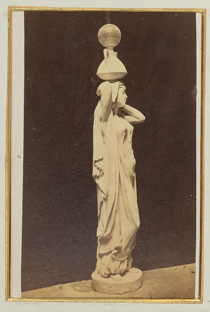 Unidentified statue of a robed female with a vase and sphere on her head