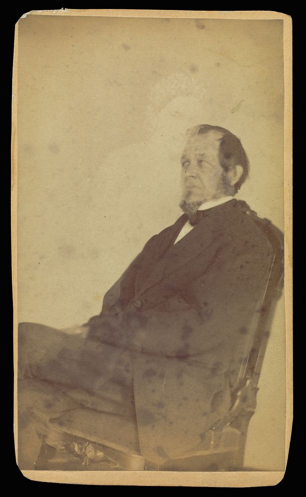 Unidentified man seated with female "spirit" by William H Mumler