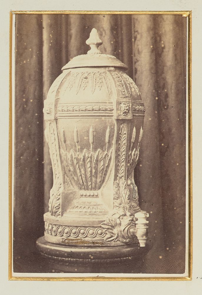 Intricate urn in front of a curtain by George J Tear