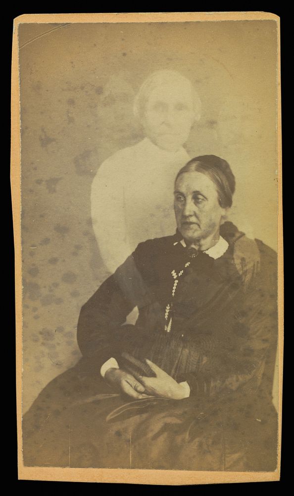 Unidentified elderly woman seated, three "spirits" in the background by William H Mumler