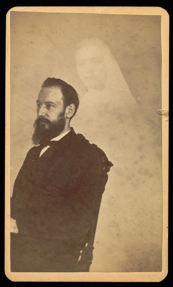 Unidentified bearded man seated, a female "spirit" in the background by William H Mumler
