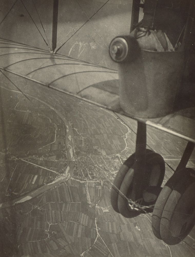 Aerial shot, cityscape and airplane wheels by Fédèle Azari